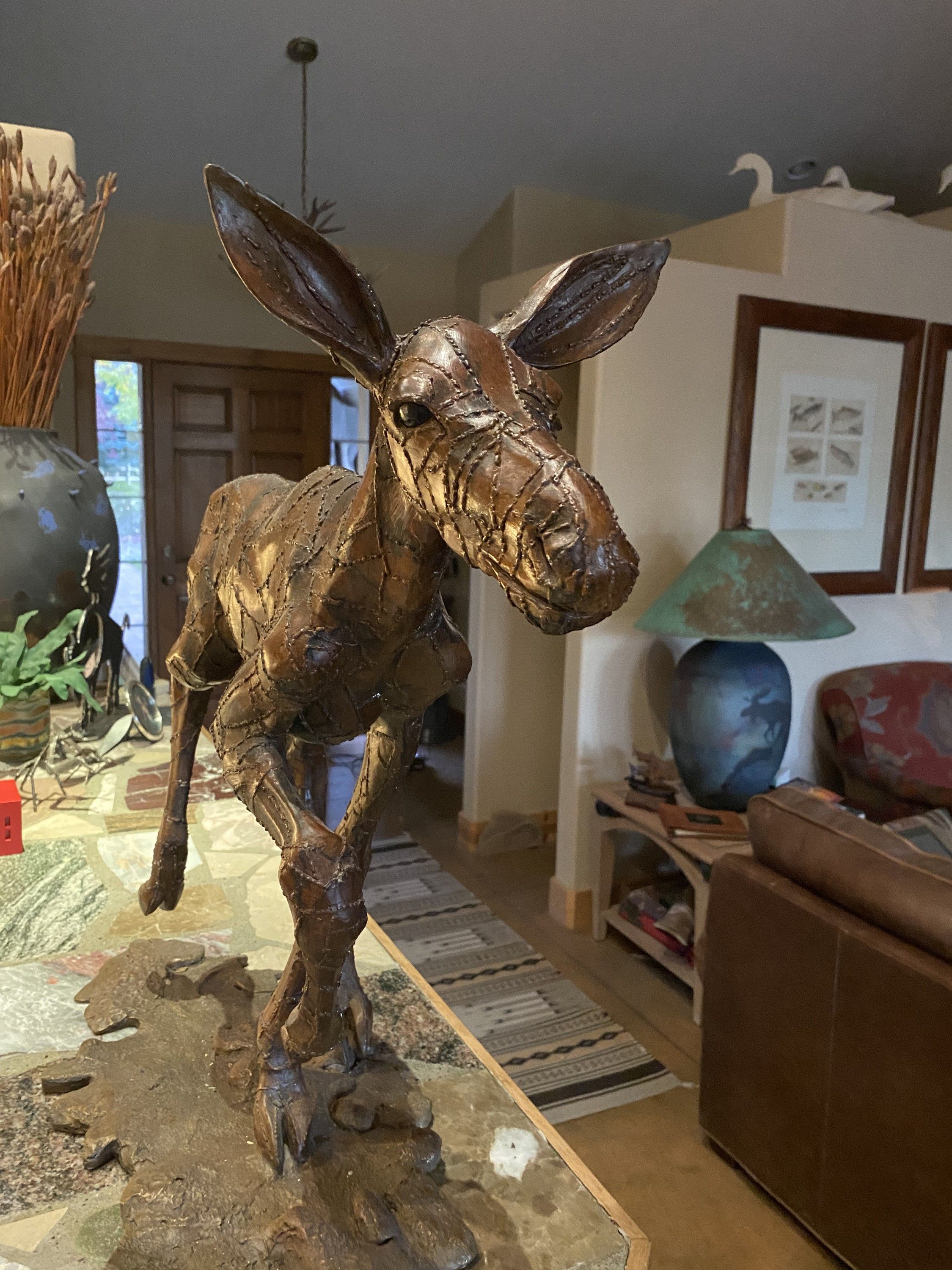 Head and ears of the Pointed Down Baby Moose in patinaed bronze