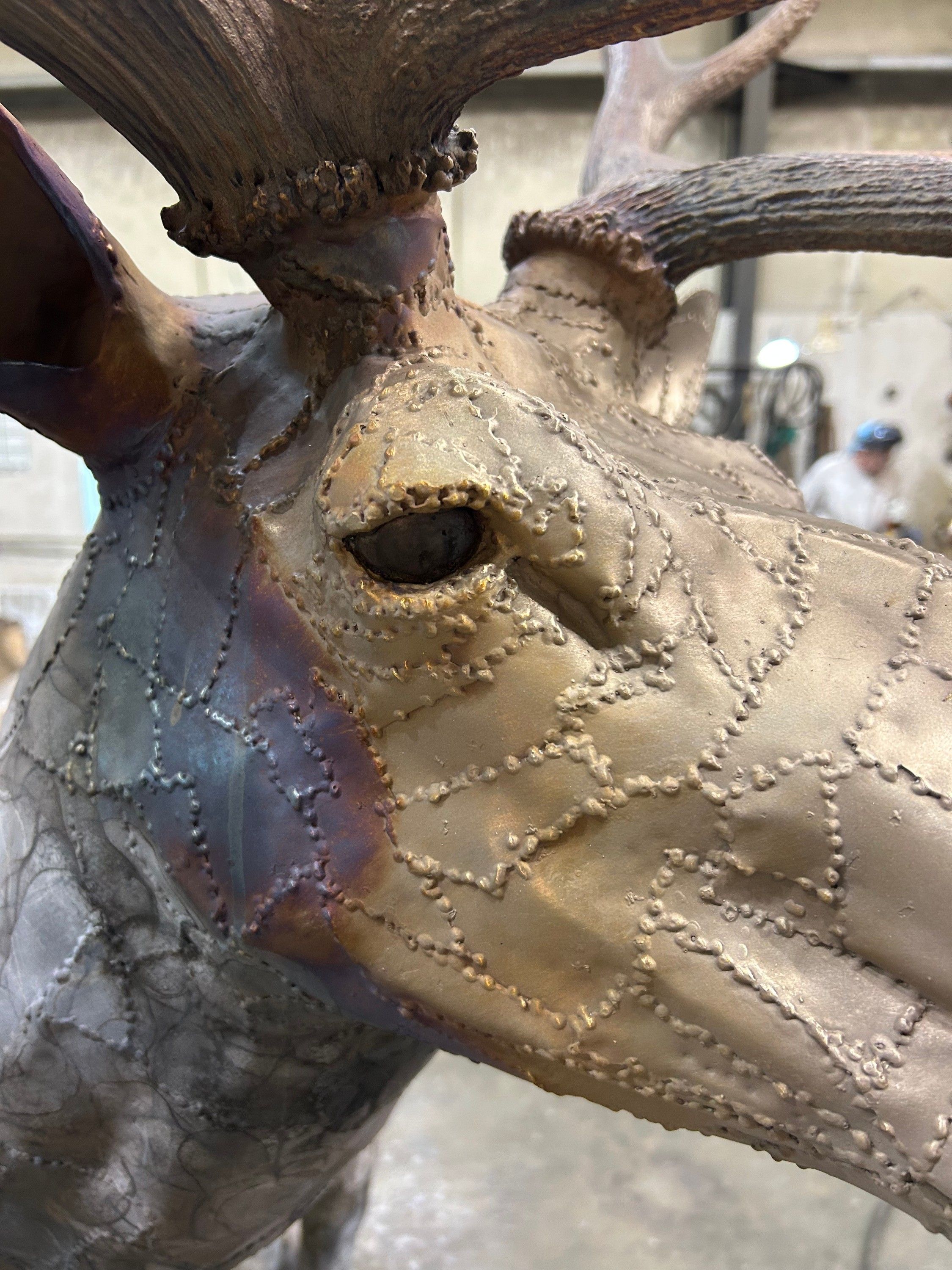Close view of the welded steel bull elk's head showing patchwork weld seams
