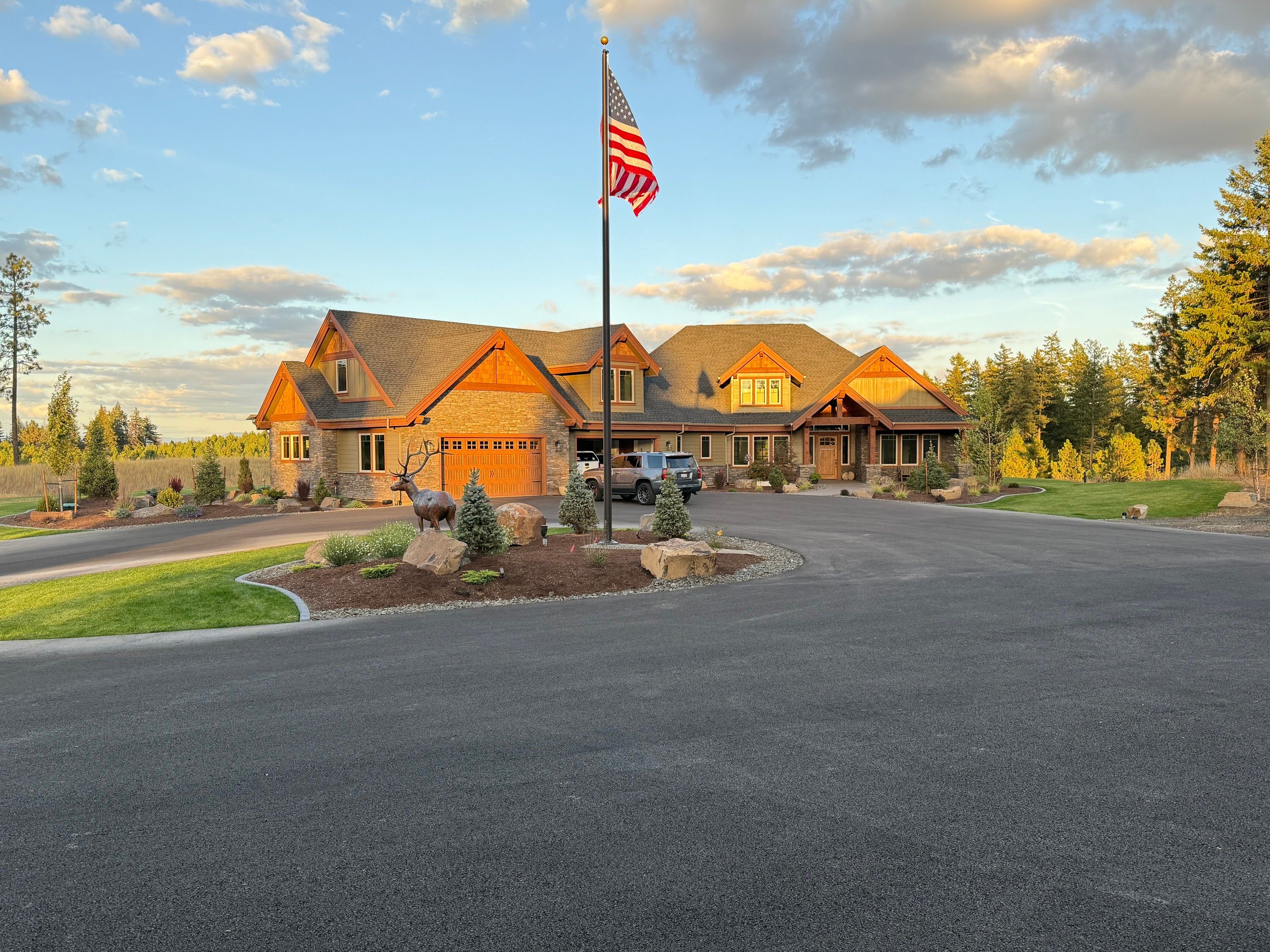 The bronze bull elk installed in a driveway island at a private residence