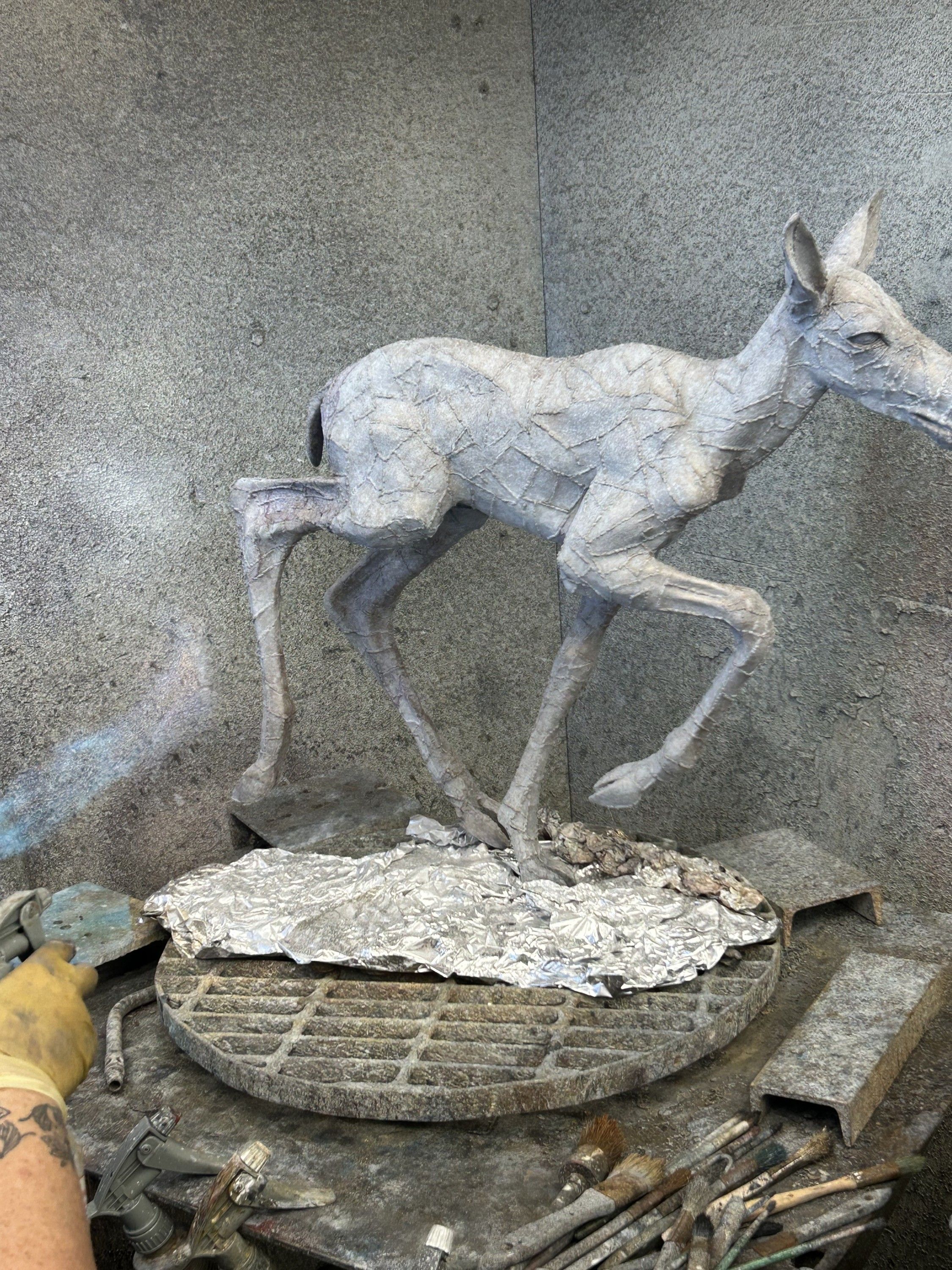 Patina progression, step 1 of 7 — the casting sandblasted white before patina
