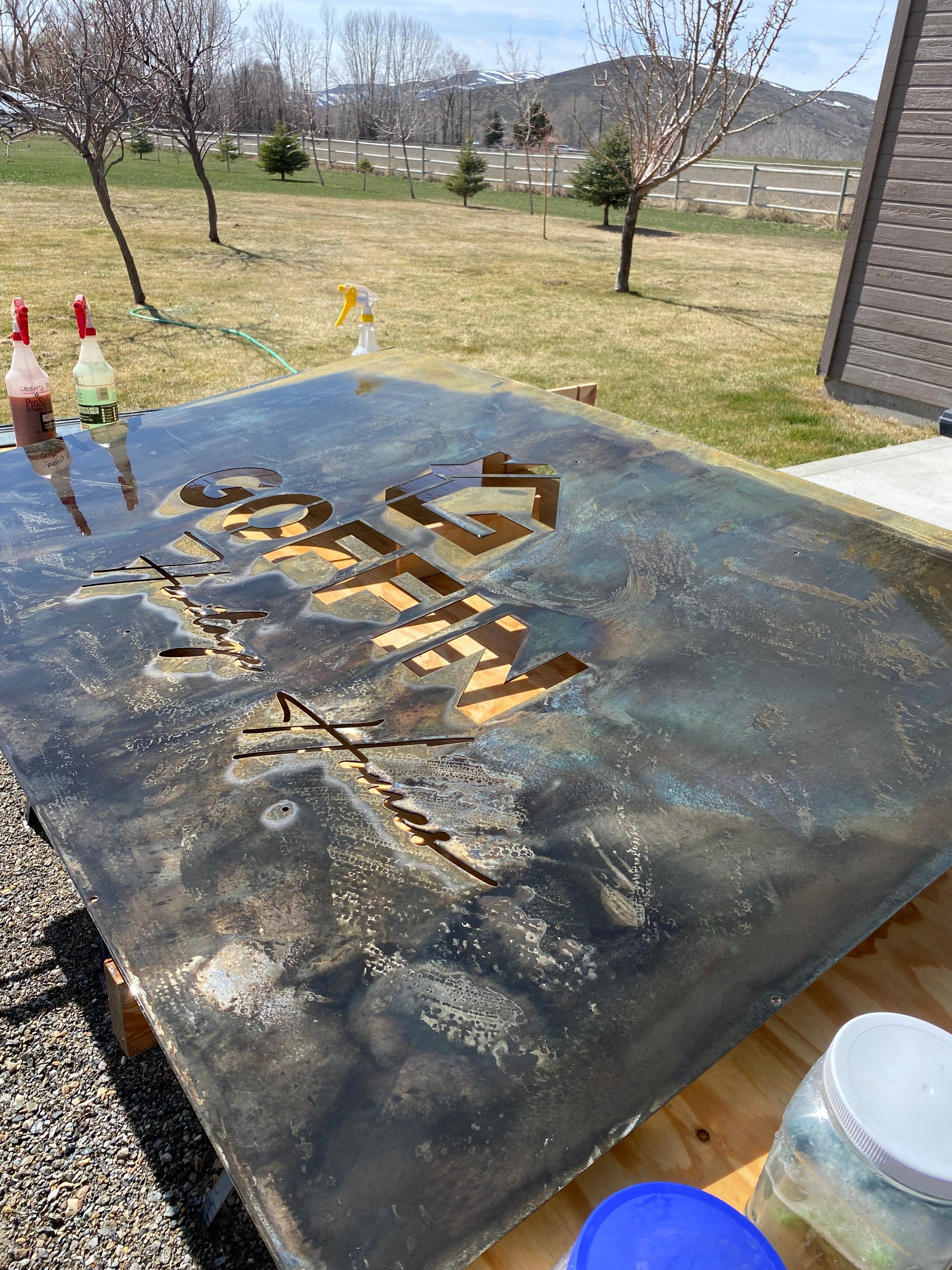 Patina developing on the Goffin panel on an outdoor work table